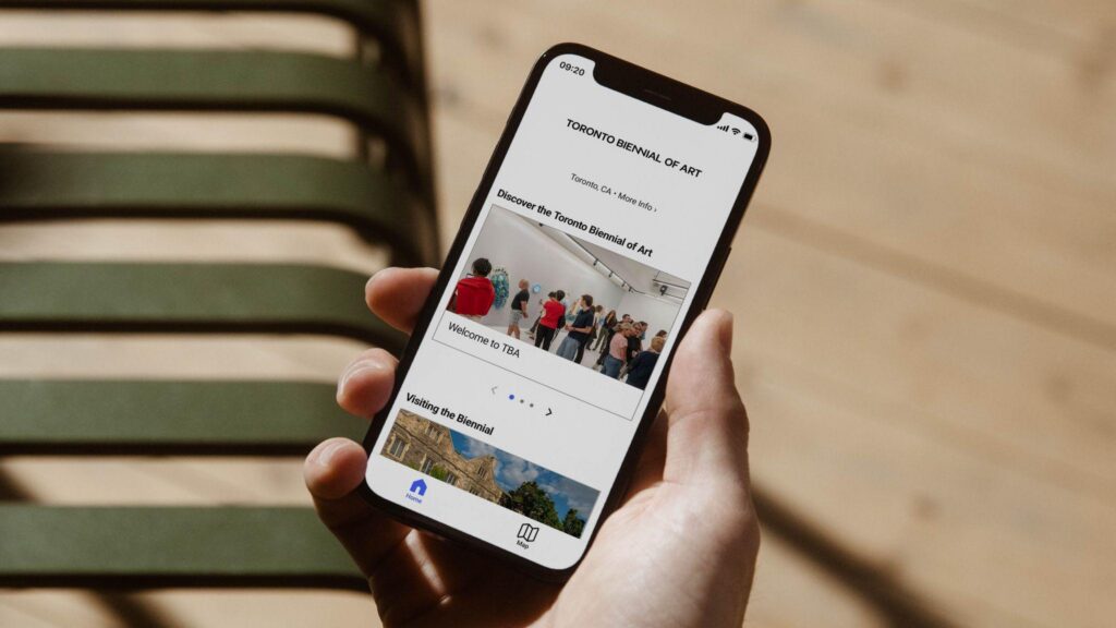 person holding phone displaying bloomberg connects guide